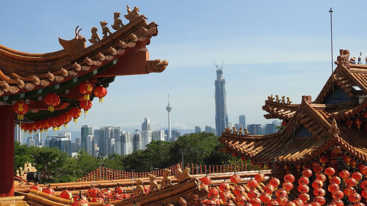 Thean Hou Temple roof with the Kuala Lumpur skyline behind